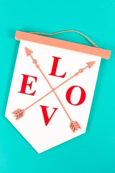Finished LOVE sign on a teal background