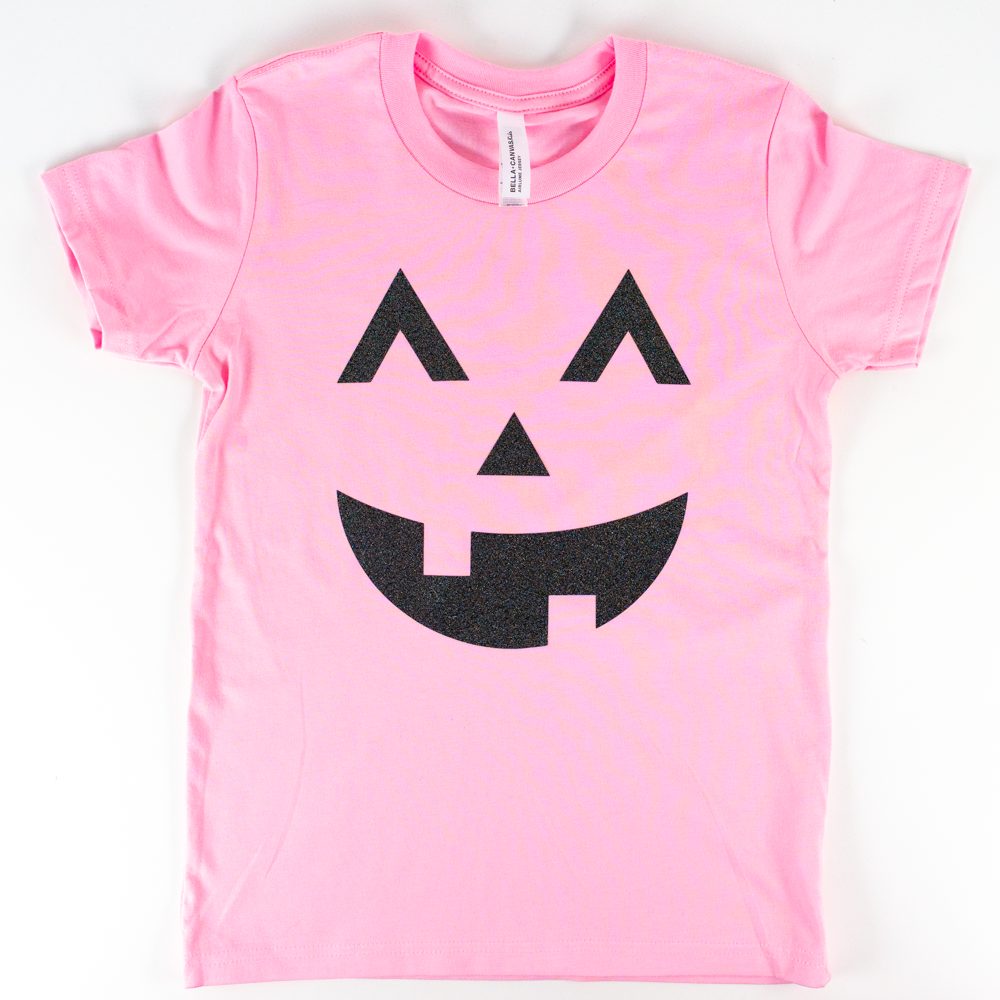 Pink t-shirt with black glitter jack-o-lantern transfer